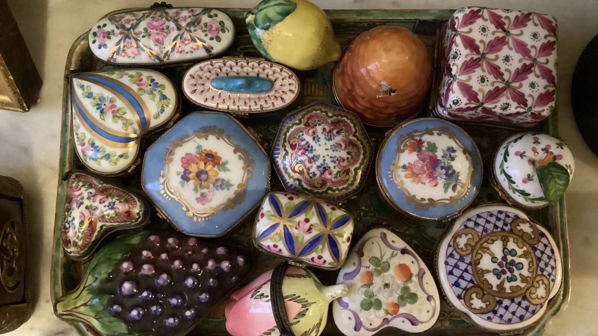 Antiques being appraised by an expert antique buyer in Charlotte, NC at Let Go Liquidation